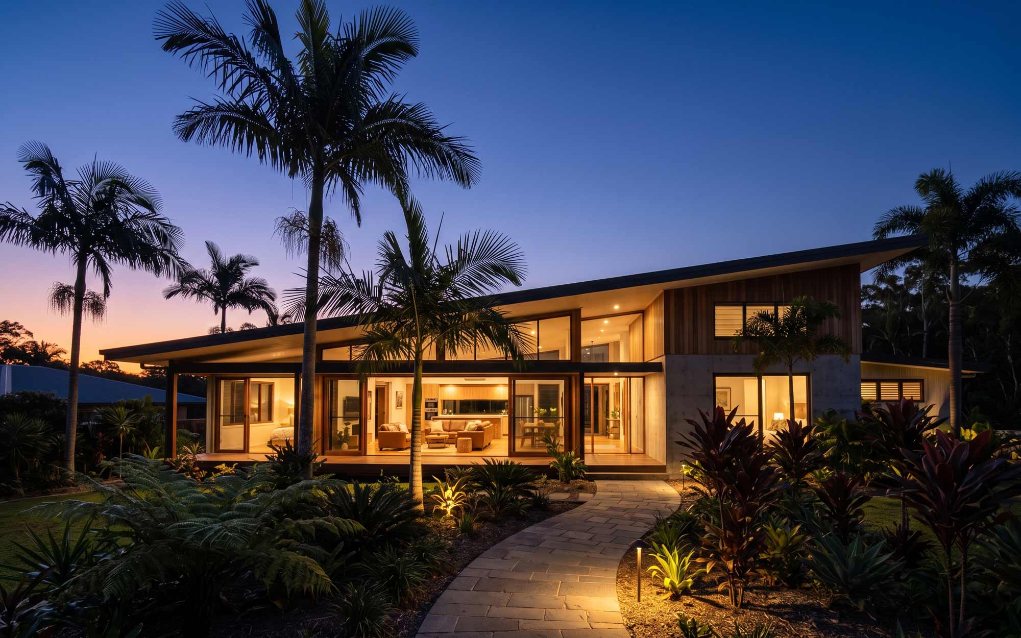 Finished home at dusk, lights on